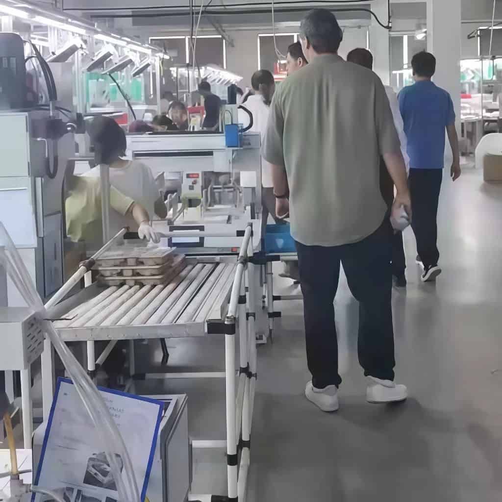 Visit Our Factory 4 Visitors touring a cleaning appliance manufacturing factory in Suzhou.